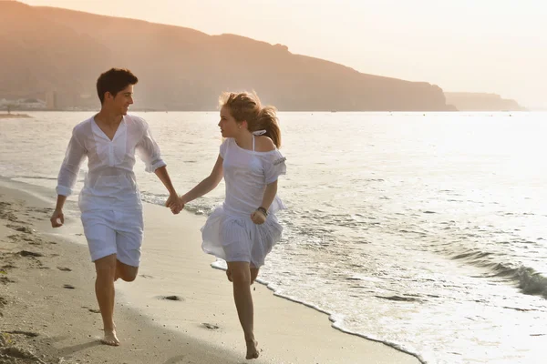 Happy young couple together on the beach — Stock Photo, Image