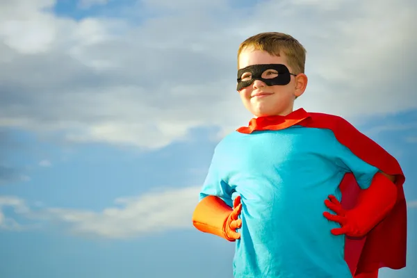 Child pretending to be a superhero Stock Photo
