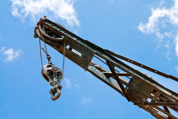 Block and tackle, ball and hook on industrial crane