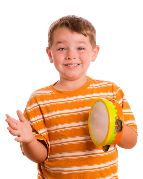 Szczęśliwy uśmiechający się dziecko grać tamburyn na białym tle — Zdjęcie stockowe