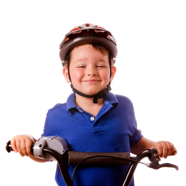 Happy child riding his bike isolated on white — Stock Photo, Image