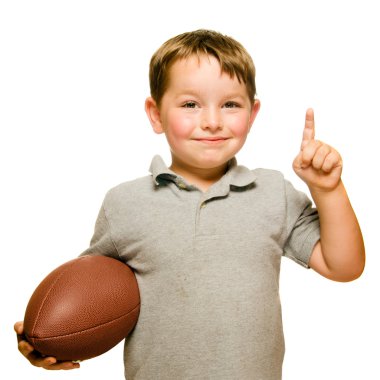 Child with football celebrating by showing that he's Number 1 isolated on white clipart