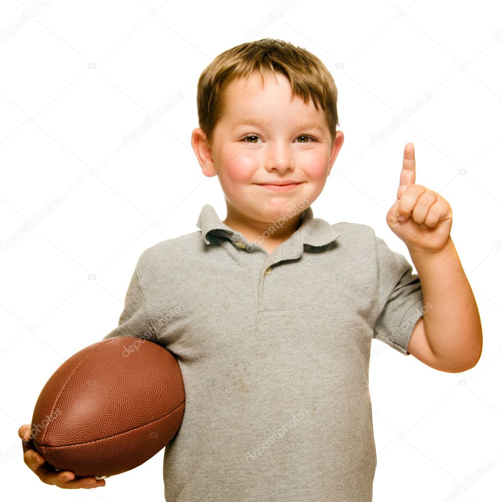 Child with football celebrating by showing that he's Number 1 isolated on white