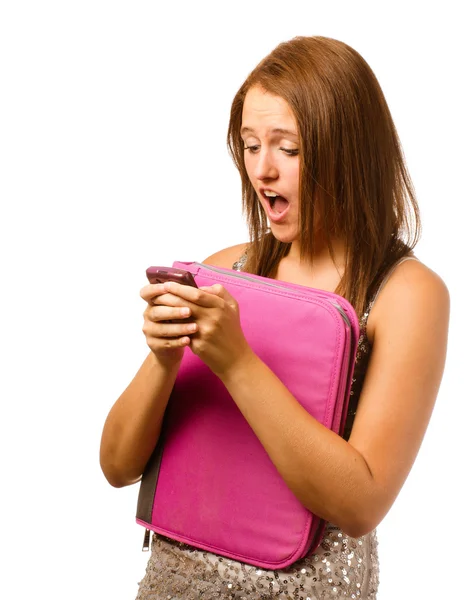 Texting teen schoolgirl reacts with shock and surprise isolated on white — Stock Photo, Image