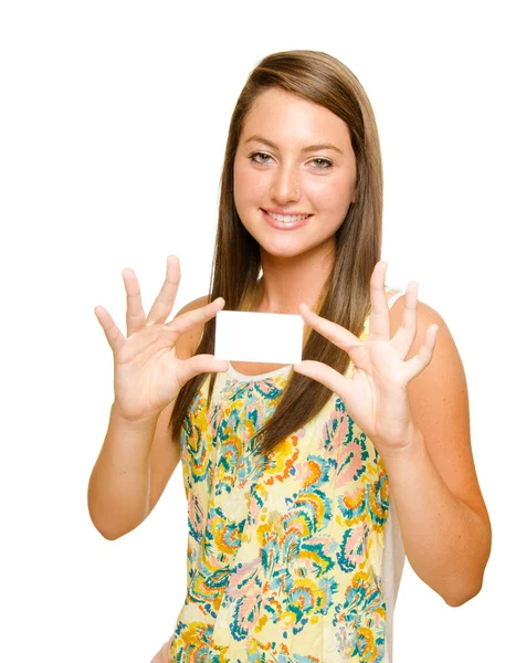 Menina adolescente segurando cartão de visita em branco isolado no branco com espaço para texto — Fotografia de Stock