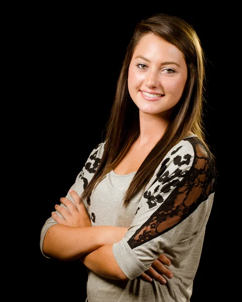Portrait of pretty smiling happy teenage girl isolated on black — Stock Photo, Image