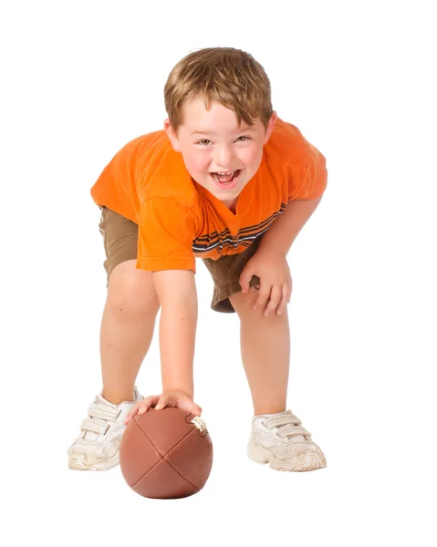 Enfant jouant avec le football américain isolé sur blanc — Photo