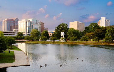 Cityscape scene of downtown Huntsville, Alabama, from Big Spring Park at sunset clipart