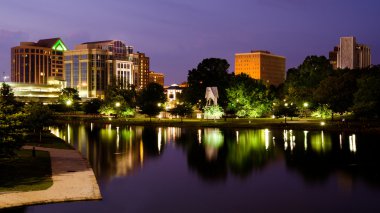 Cityscape scene of downtown Huntsville, Alabama, from Big Spring Park after sunset clipart