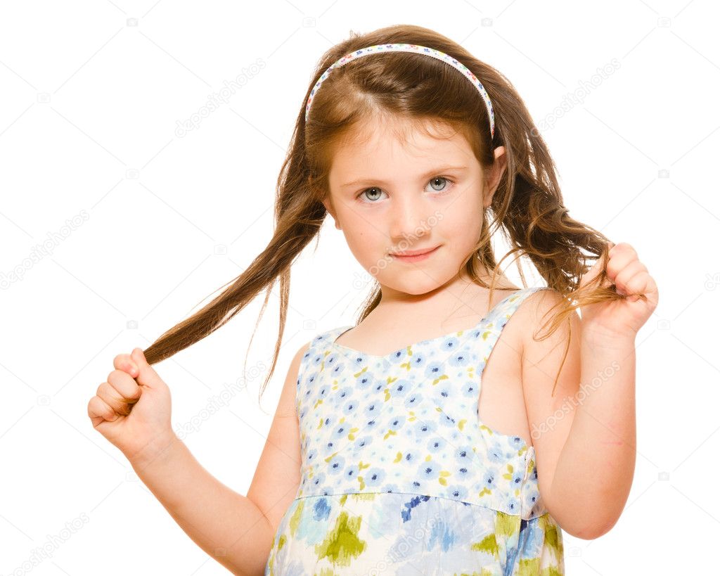 Hair care concept with portrait of young girl holding her long hair isolated on white