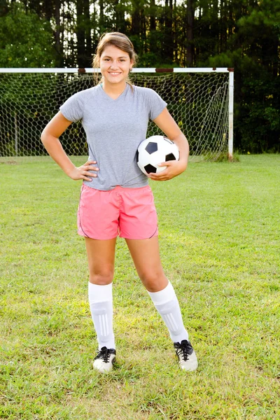 Portrait of teen girl soccer player on field — Stock Photo, Image