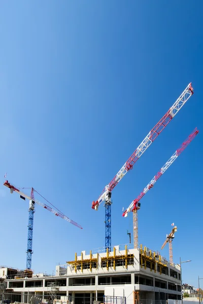 Cranes and the construction site — Stock Photo, Image