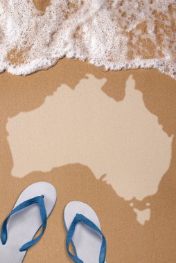 Australian textured map in wet sand on the beach clipart