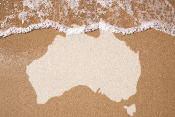 Пісок з картою австралійському континенті — стокове фото