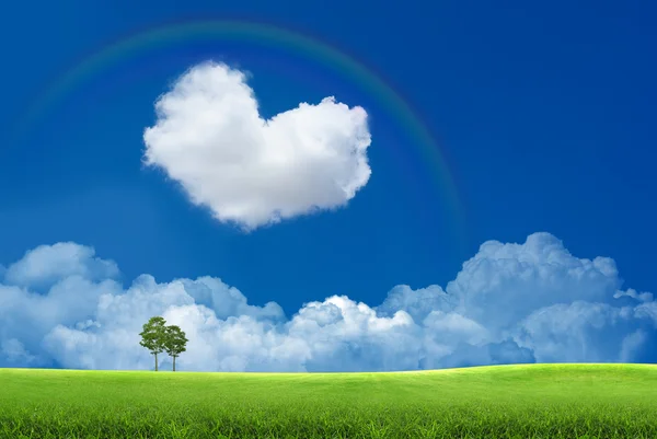 Blue sky with clouds and a rainbow — Stock Photo, Image