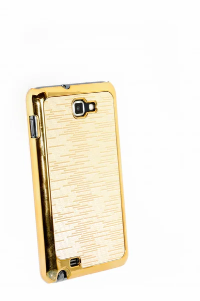 Золотой мобильный телефон — стоковое фото