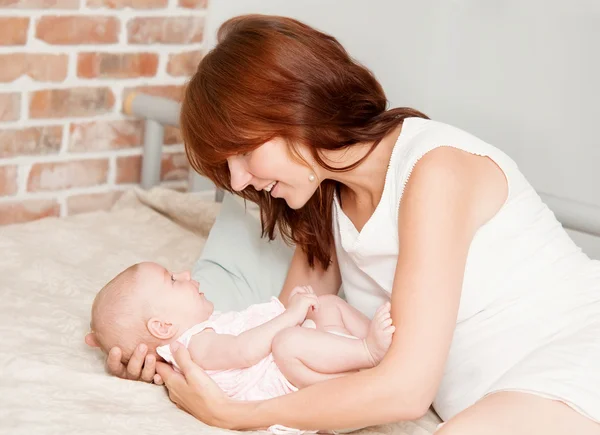 Mother holding sweet baby — Stock Photo, Image