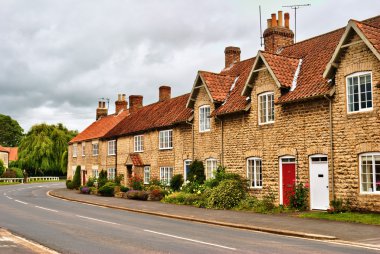 Quaint row of English village houses clipart