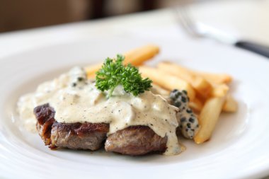 Beef steak with white sauce clipart