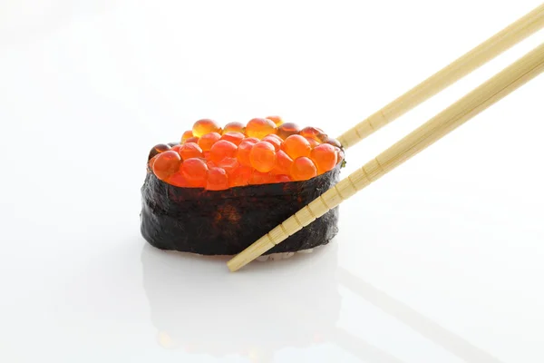 Salmon egg on sushi nigiri roll — Stock Photo, Image