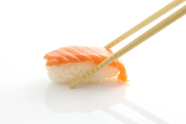 Salmon sushi with chopsticks — Stock Photo, Image
