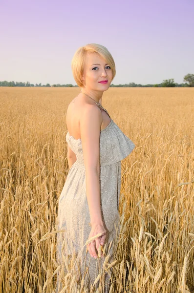 Pretty blond woman in dress outdoor — Stock Photo, Image