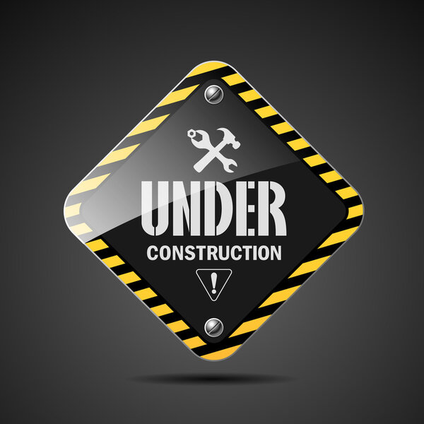 Under construction sign on black background