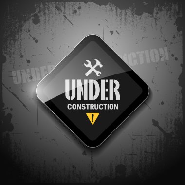 Under construction sign on grunge background clipart