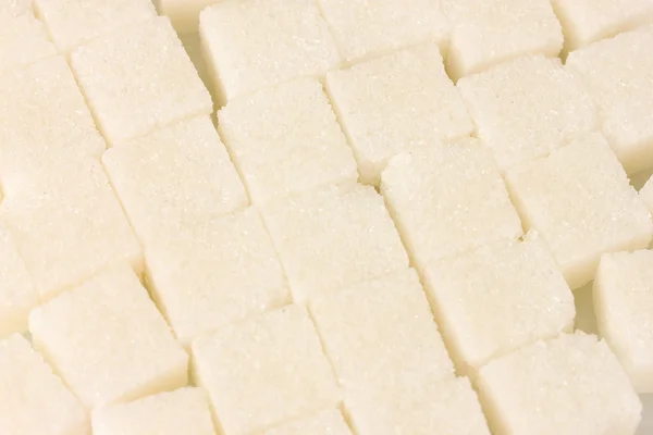 White lump sugar background close-up — Stock Photo, Image