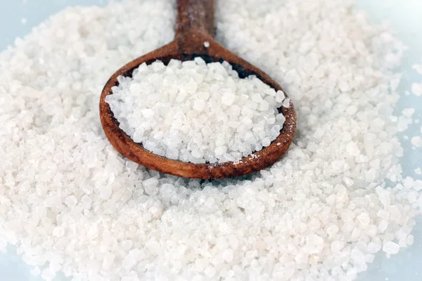 Sea salt with wooden spoon close-up — Stock Photo, Image