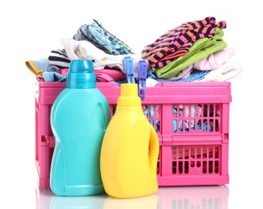 Clothes with detergent in pink plastic basket isolated on white clipart