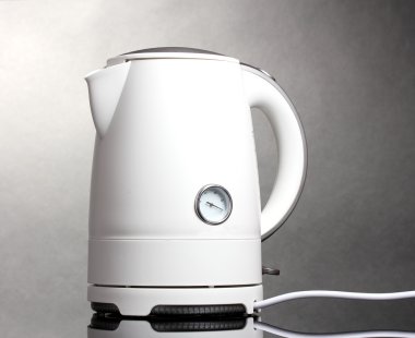 White electric kettle on grey clipart