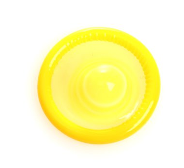 Yellow condom isolated on white clipart