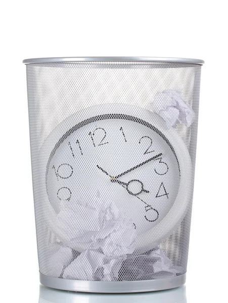 Stock image Wall Clock in metal trash bin and paper isolated on white