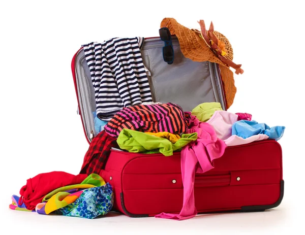 Open red suitcase with clothing isolated on a white — Stock Photo, Image