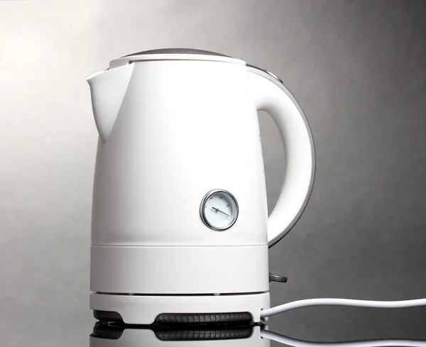 White electric kettle on grey — Stock Photo, Image