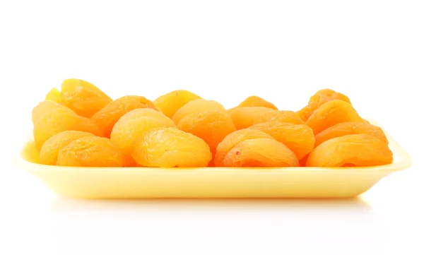Délicieux abricots secs dans un emballage isolé sur blanc — Photo