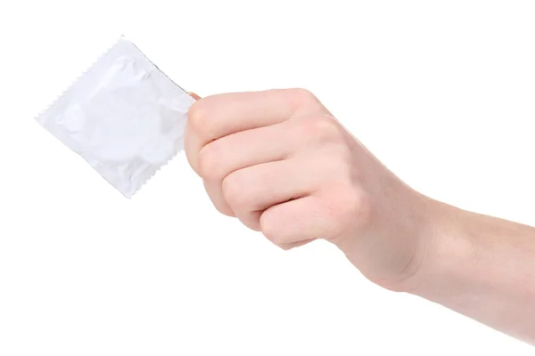 Mano tenendo un preservativo isolato su bianco — Foto Stock