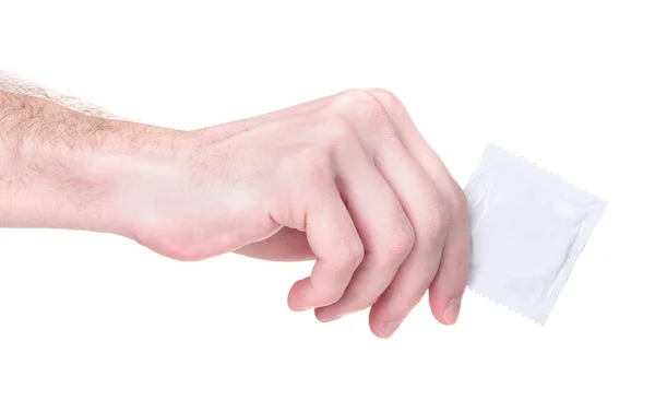 Hand met een condoom geïsoleerd op wit — Stockfoto