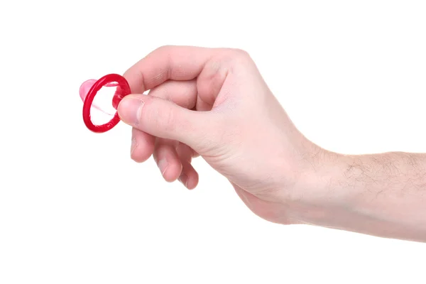 Ruka držící kondom izolované na bílém — Stock fotografie