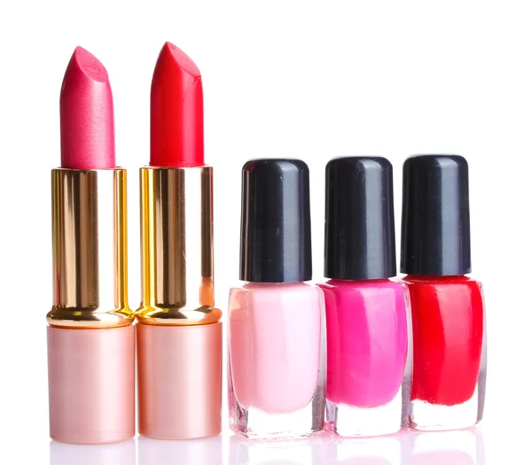 Bright lipsticks and nail polishes isolated on white — Stock Photo, Image