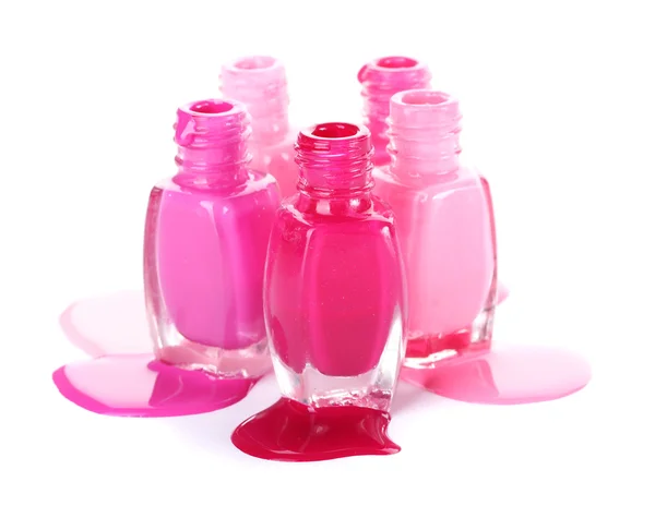 Öppna flaskor med ljusa nagellack isolerad på vit — Stockfoto