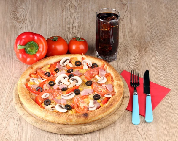 Aromatic pizza and cola on wooden background — Stock Photo, Image