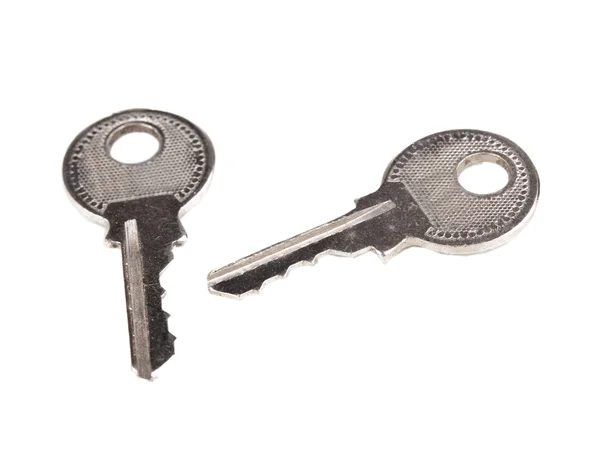 Duas chaves de metal isoladas em branco — Fotografia de Stock