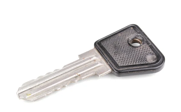 白で隔離される金属製のキー — ストック写真