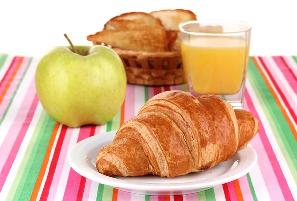 Klasické snídaně. pomerančová šťáva a croissant — Stock fotografie