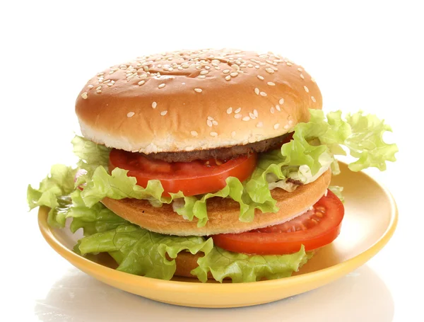 Hambúrguer grande e saboroso na placa isolada no branco — Fotografia de Stock