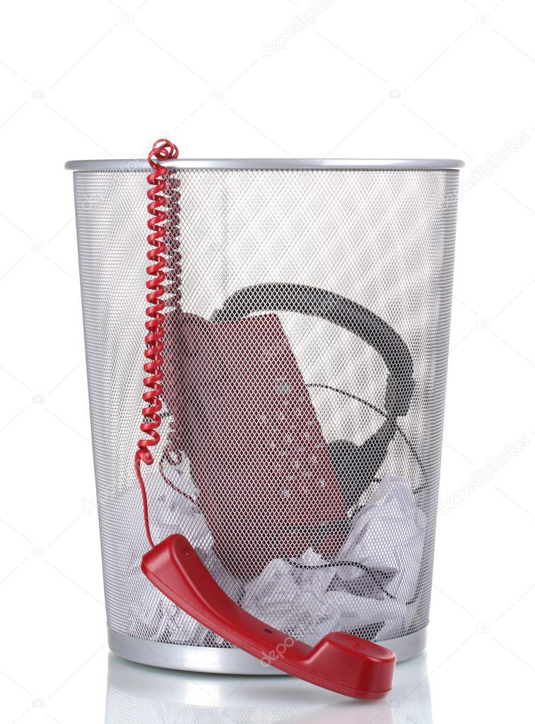 Red phone,headphones and paper in metal trash bin isolated on white