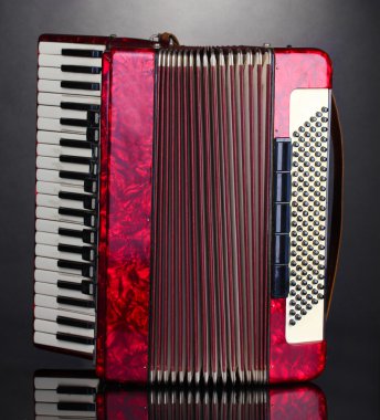 Retro accordion on grey background clipart