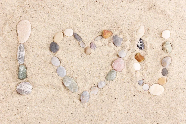Love-stones on sand — Stock Photo, Image